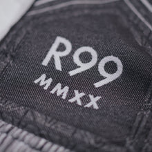 Load image into Gallery viewer, Close up of R99 MMXX on scarf.
