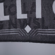 Load image into Gallery viewer, Close up of Art Deco embellishments on border of scarf.

